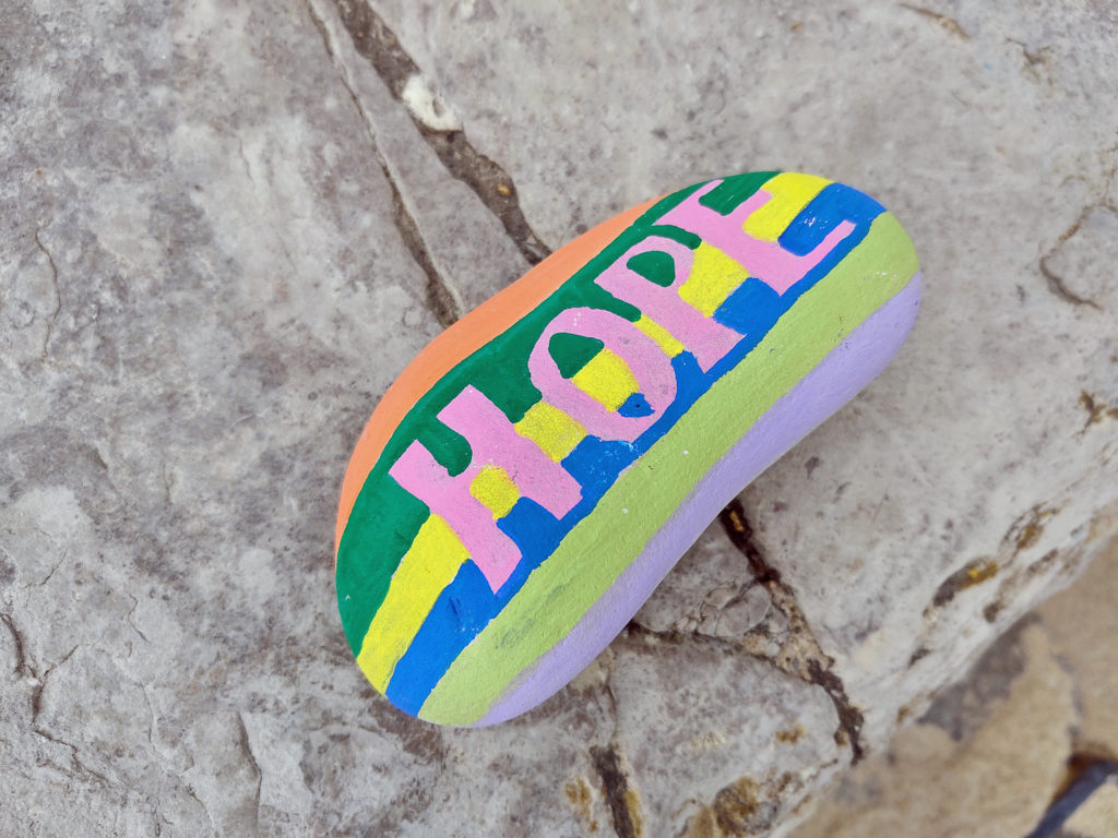 Painted pebble with the message of hope