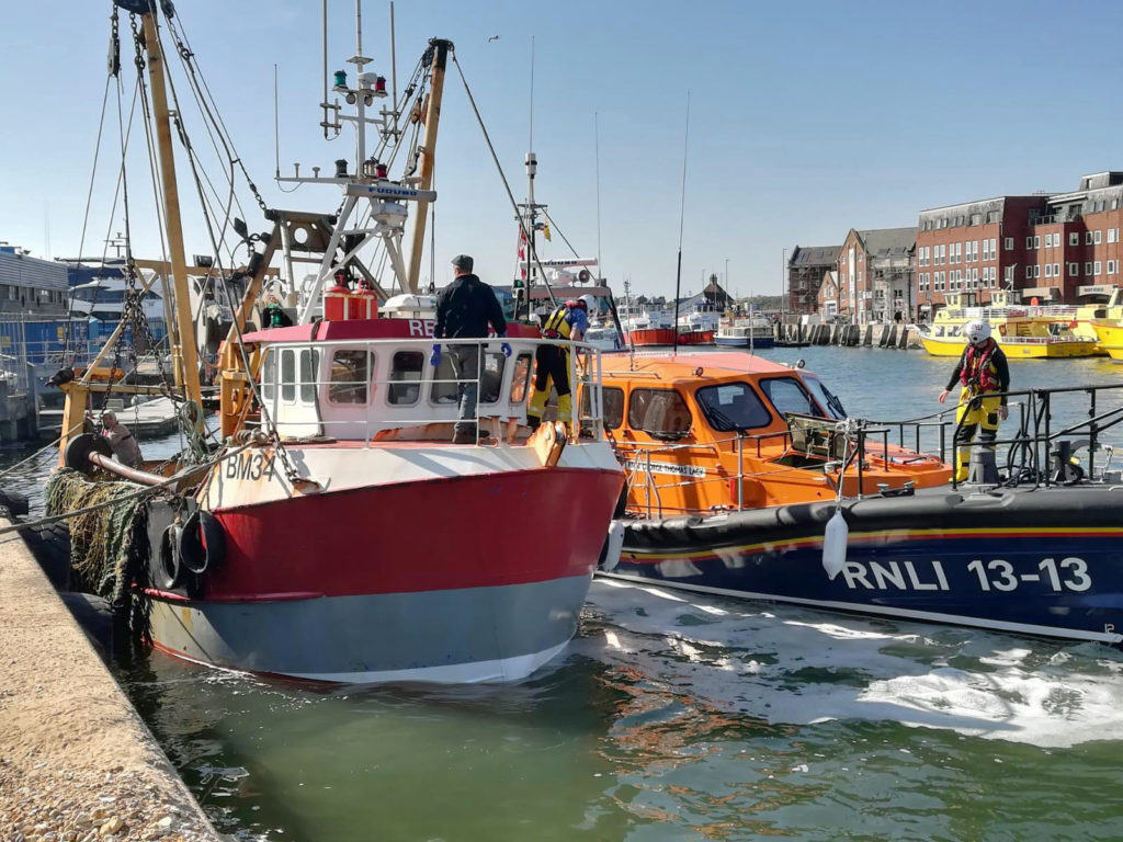 Rescued fishing Vessel in Poole Harbour with Swanage Lifeboat