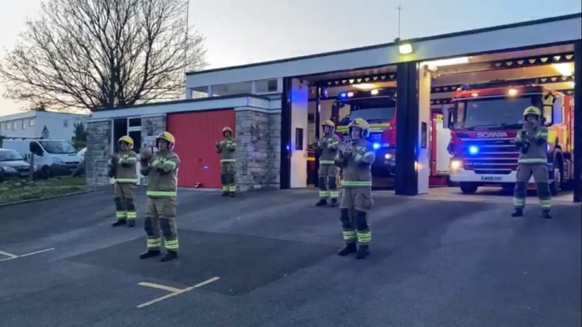 Swanage Firefighters standing outside the fire station