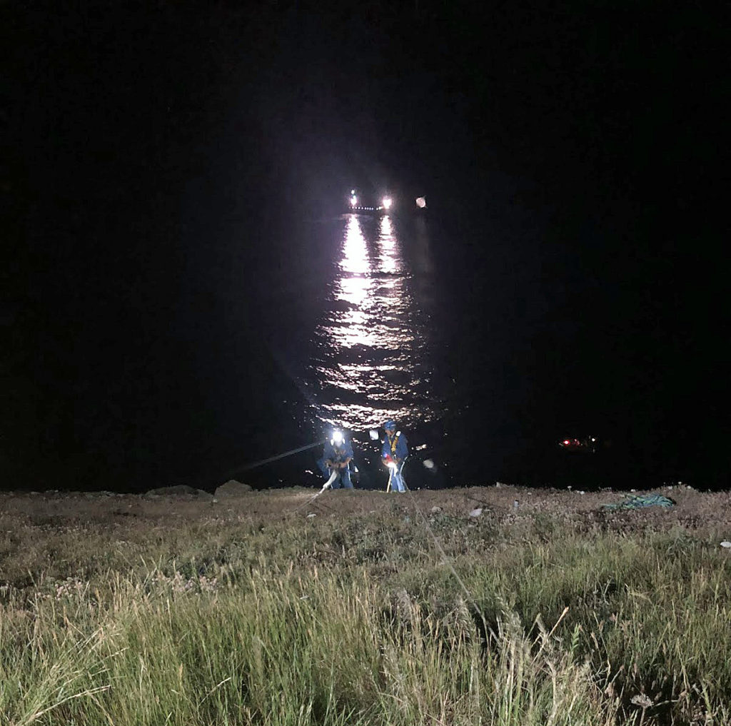 Climber being rescued from cliffs near Anvil Point