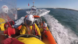 Poole lifeboat rescuing a yacht