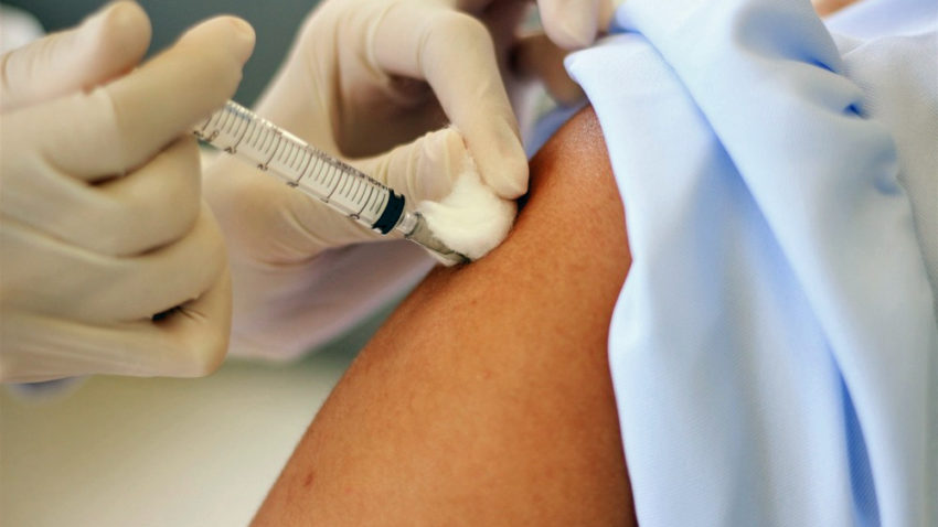 flu vaccine being injected in arm