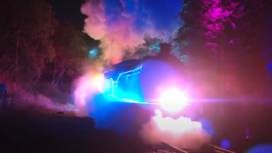 Steam train lit up with coloured lights