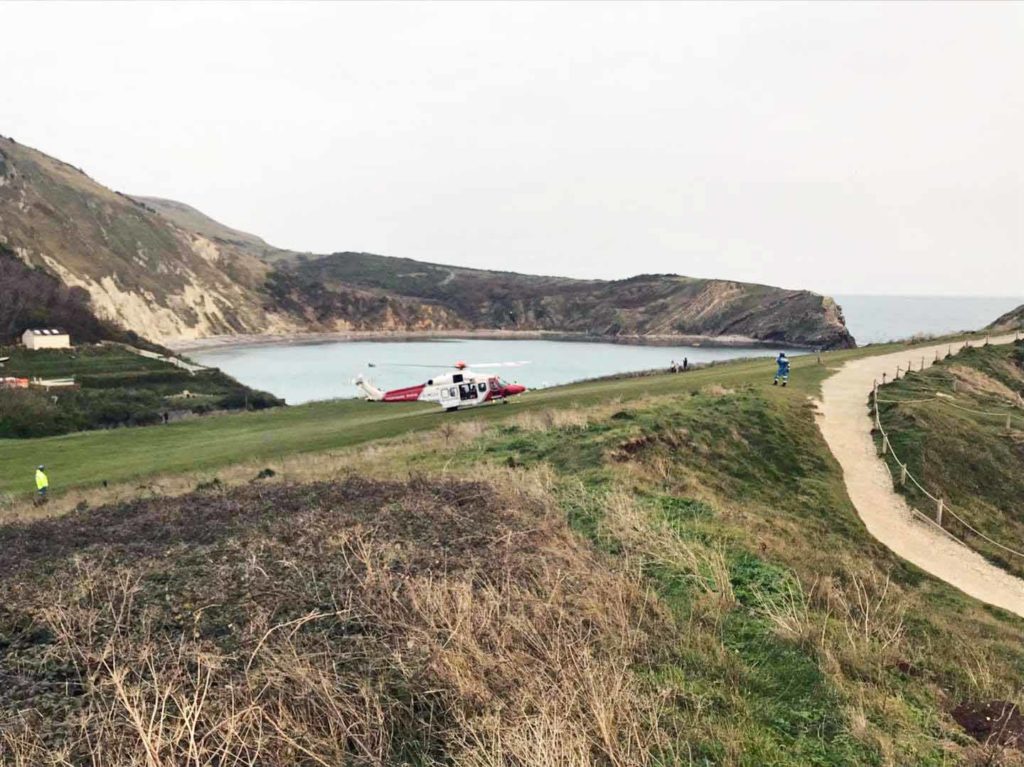 Climber being rescued by helicopter at Lulworth