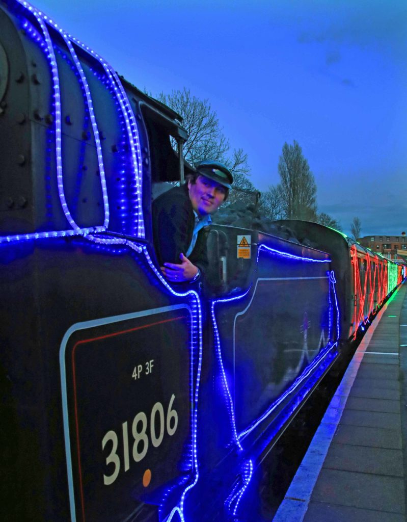 Train driver on the Steanm and Lights train