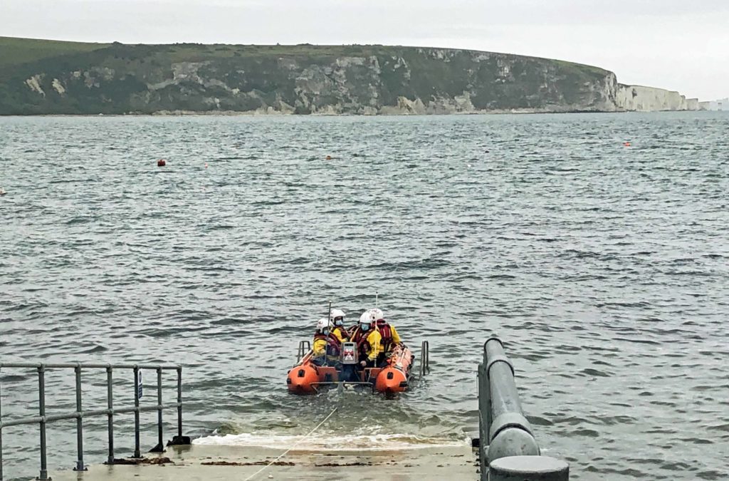 Swanage RNLI Lifeboat crew with the inshore lifeboat
