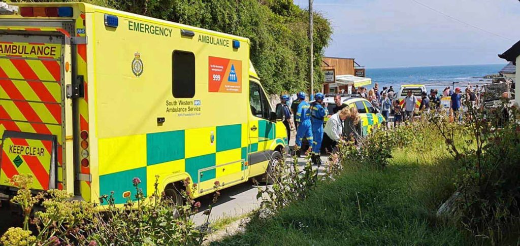 Coastguard, ambulance car and ambulance at Lulworth