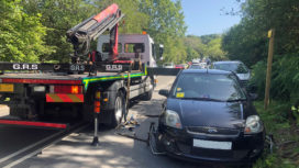 Car being removed by tow truck from Ferry Road in Studland (