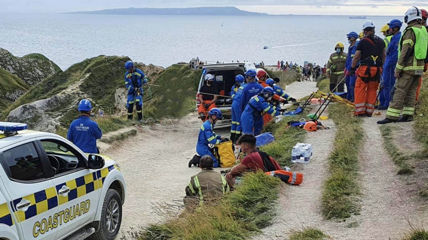Teenagers being rescued from cliff at Durdle Door