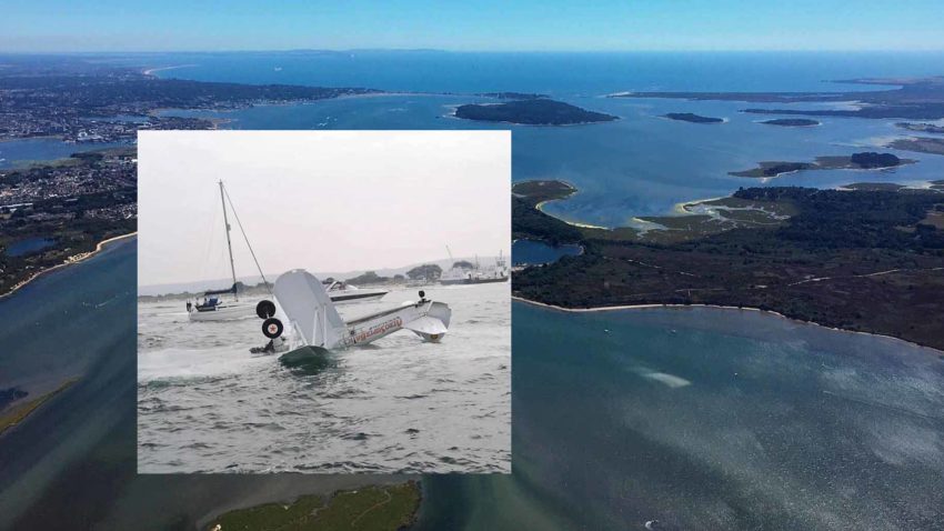 Aerial view of Poole Harbour with wingwalker plane crass inset