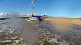 Yacht stranded on Studland beach