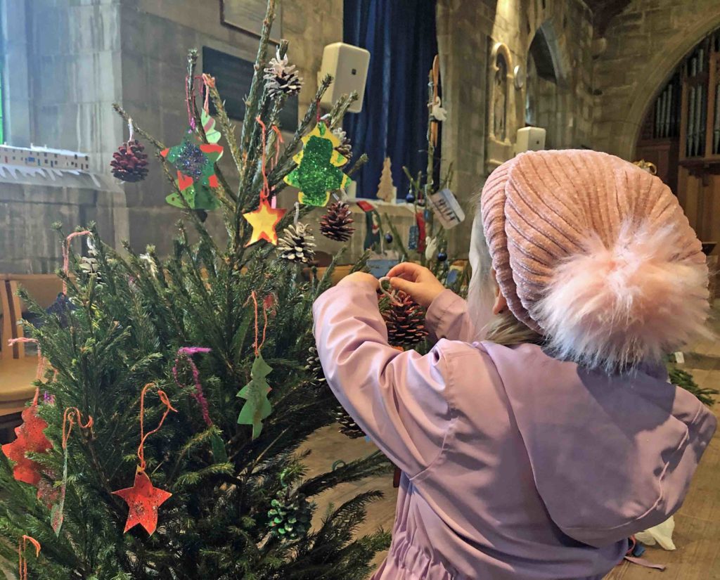 A child from St George's Pre-school at Purbeck Christmas Tree Festival