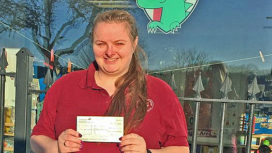St George's preschool leader receives a cheque from Swanage Folk Festival