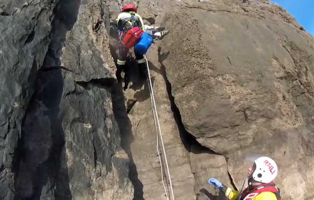 Climber being rescued from the rock face