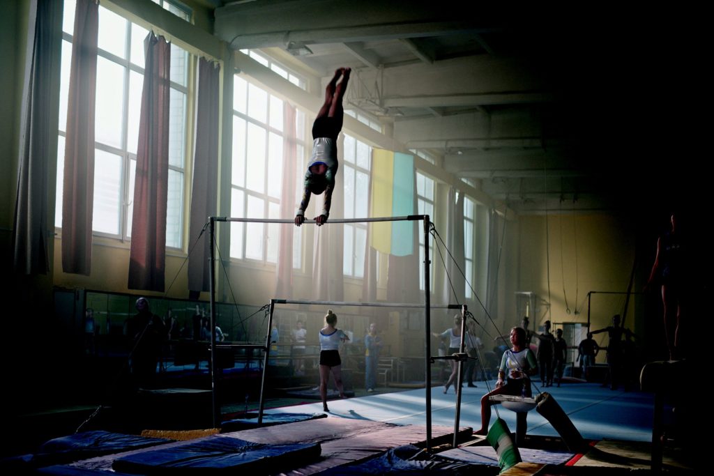 Olga performs on the bars in the Movie 