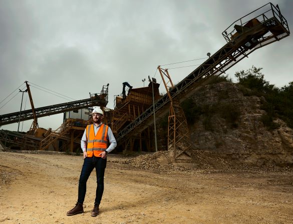 Suttles' director, John Suttle, in front of the stone crusher at Swanworth Quarry