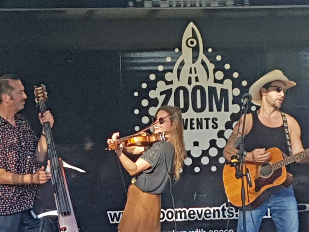 Musicians on stage at a Zoom event