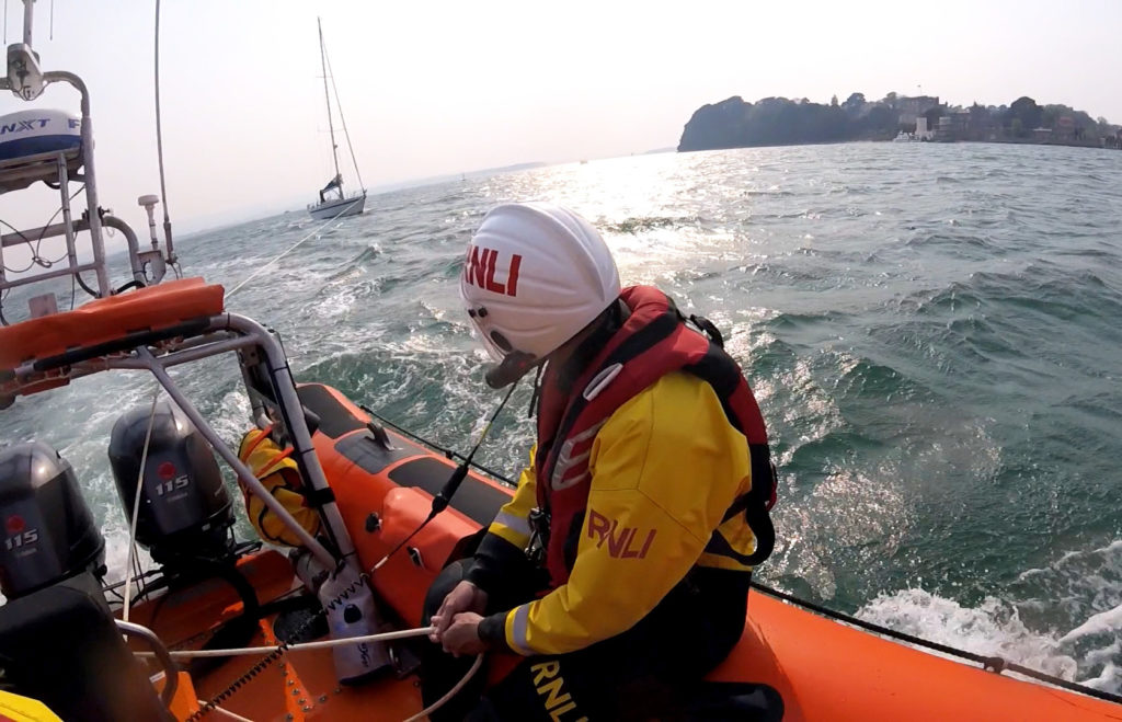 RNLI rescue yacht gone aground at Shell Beach in Studland