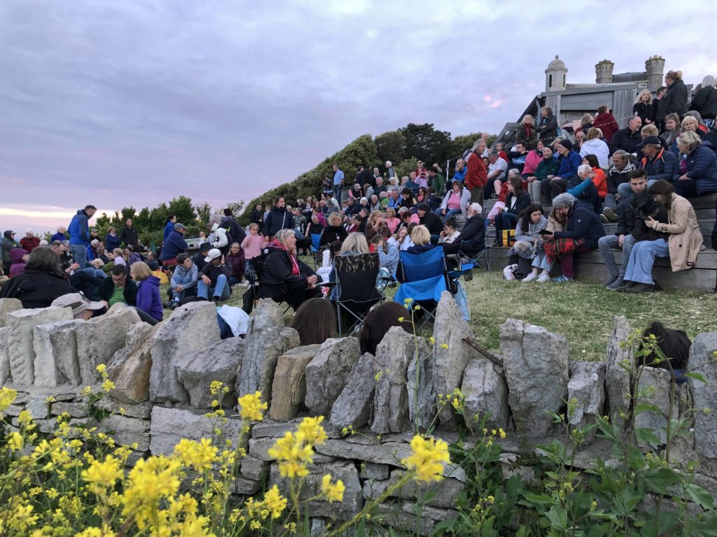 People gathering at Queen's Platinum Jubilee beacon at Durlston Castle
