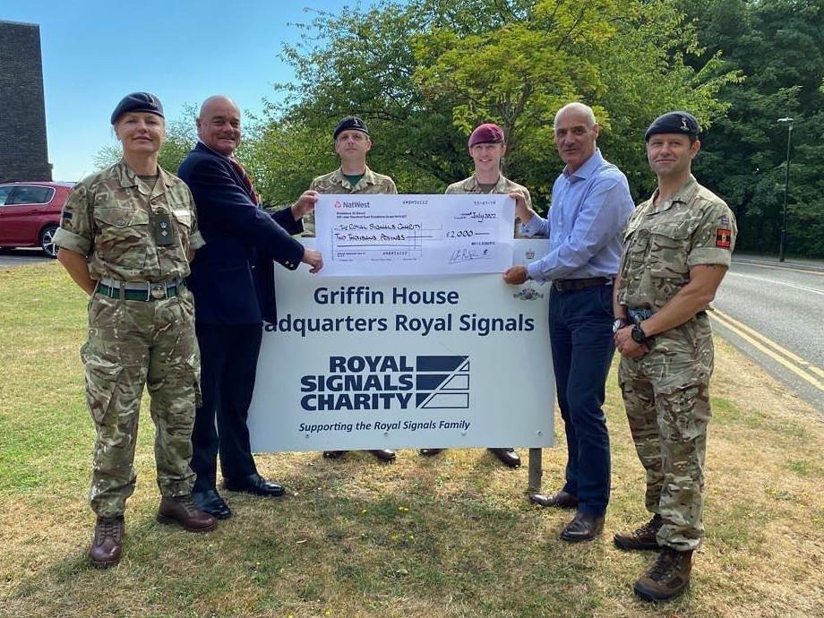 Frank Roberts hands over cheque to Royal Signals Charity