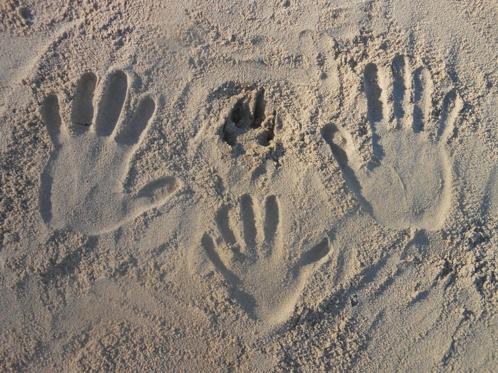 handprints in sand