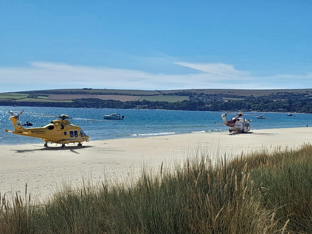 Air ambulance and Coast guard helicopter attend medical incident at Studland