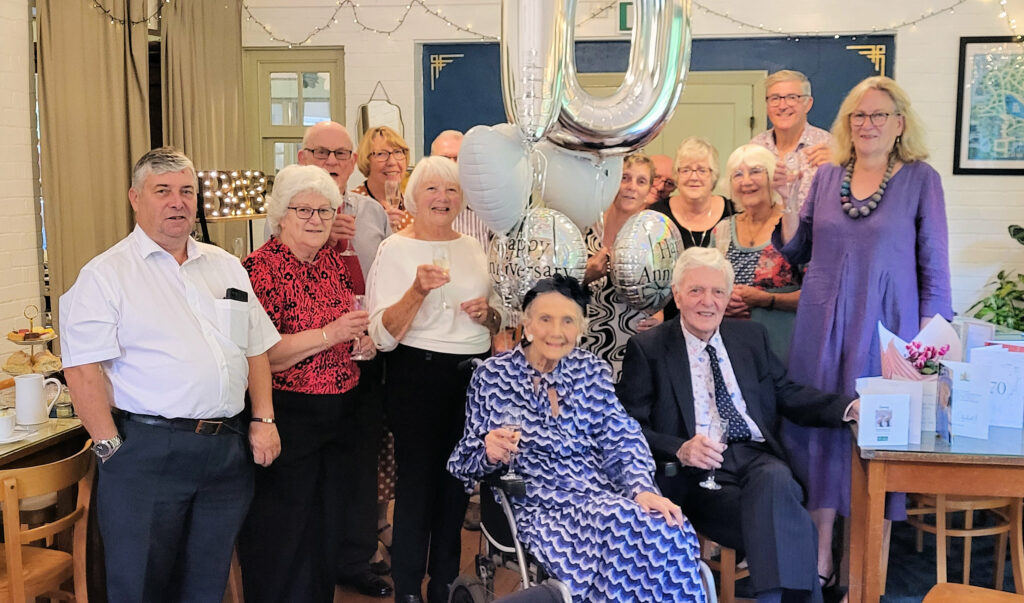 Margaret and Peter Brayshaw at their platinum wedding anniversary with guests