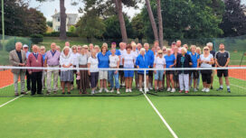 Members and VIPs of Swanage Tennis Club line up at the new of their new Astro-Turf court