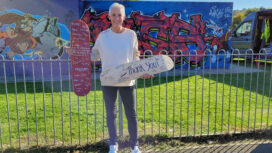 Fund raiser Lorna Haines with signed skateboards at Swanage Skatepark