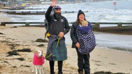 A friendly welcome as Chris Lewis, partner Kate Barron baby Magnus and Jet the dog arrive in Swanage