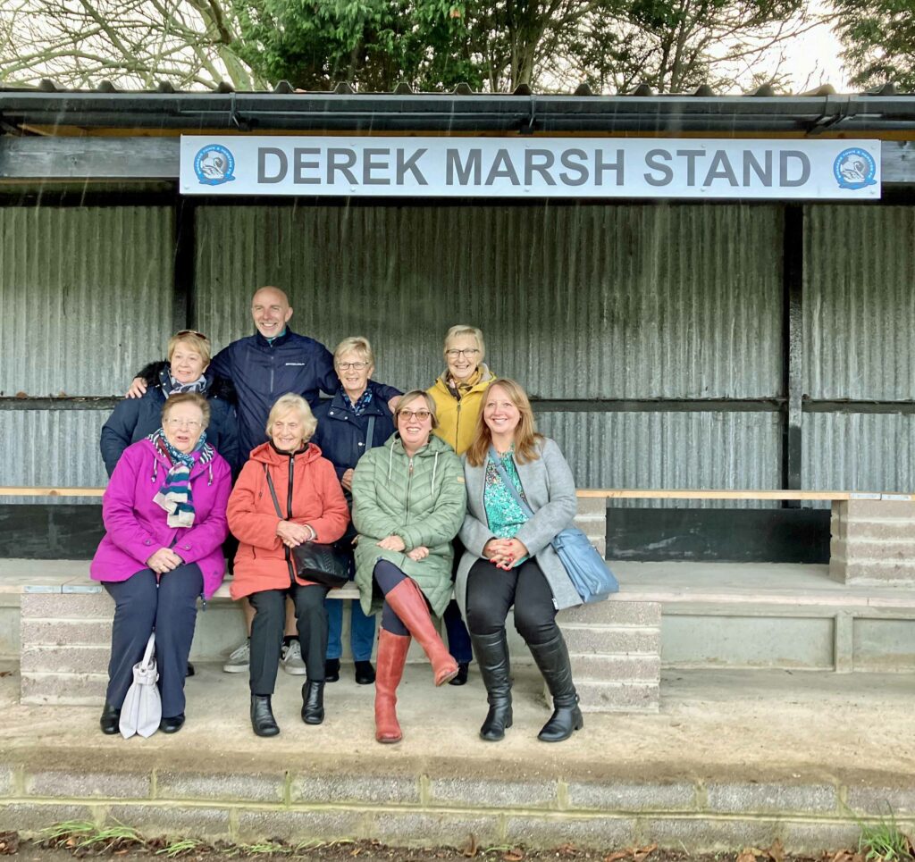 Derek Marsh stand  at football ground with his family