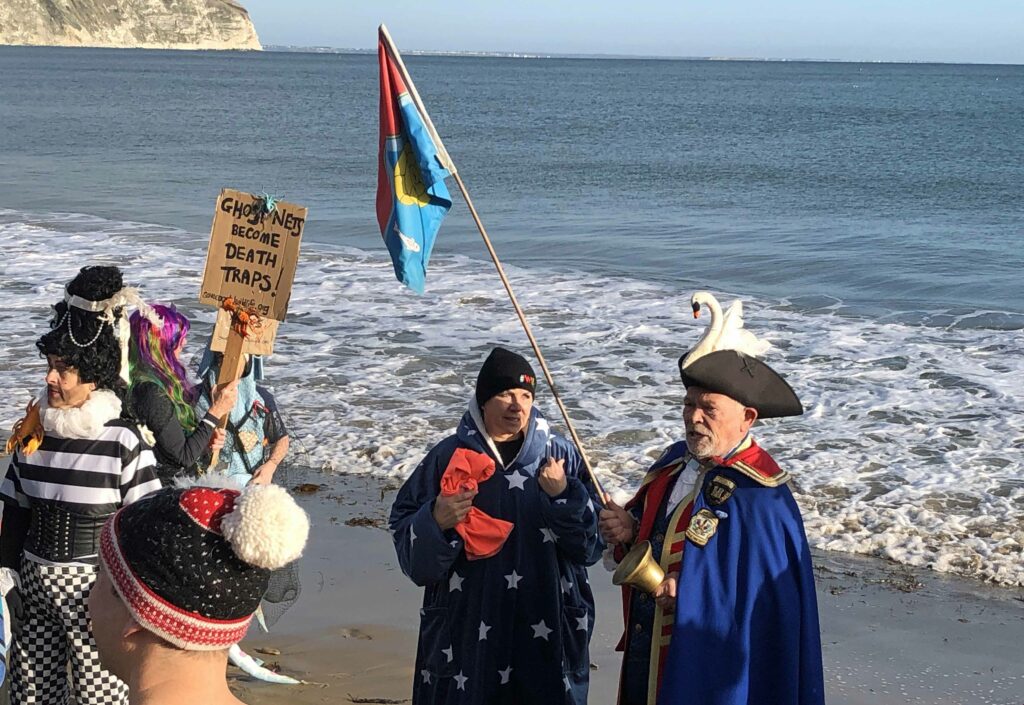 Boxing day swim 2022 on Swanage Beach with town crier and Lesley paddy from willdoes