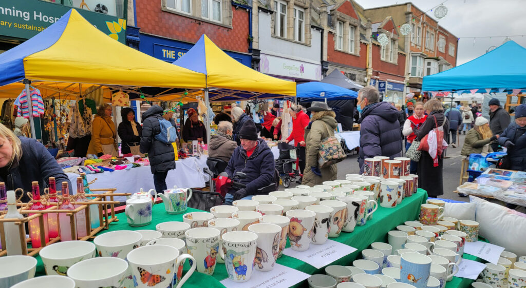 Crowds of shoppers flocked to Swanage Christmas Market despite the cold and windy weather