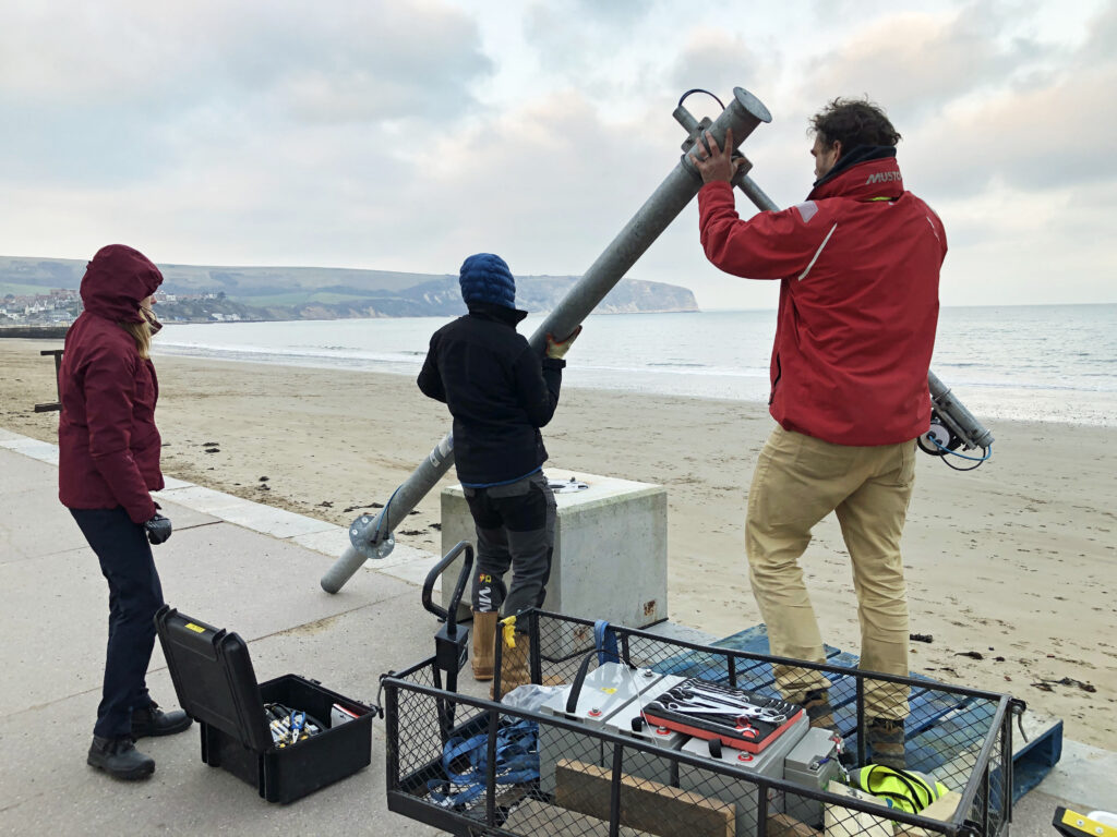 Installation of beach scanner by Univerity of Plymouth researchers on Swanage Beach