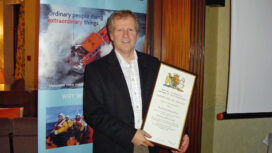 Dave Corben receiving his record of service certificate.