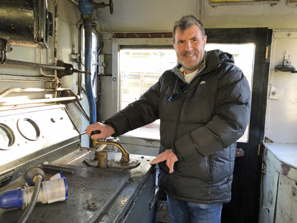 Bob Patterson inside the diesel cab at Swanage Railway