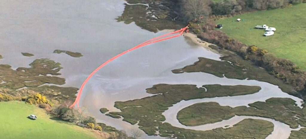 A boom was put up at the source of the leak to stop oil spilling out into the main harbour