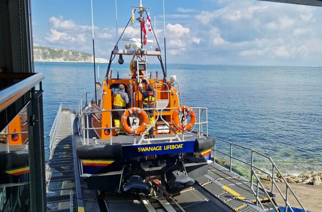 Swanage Lifeboat launches from lifeboat station