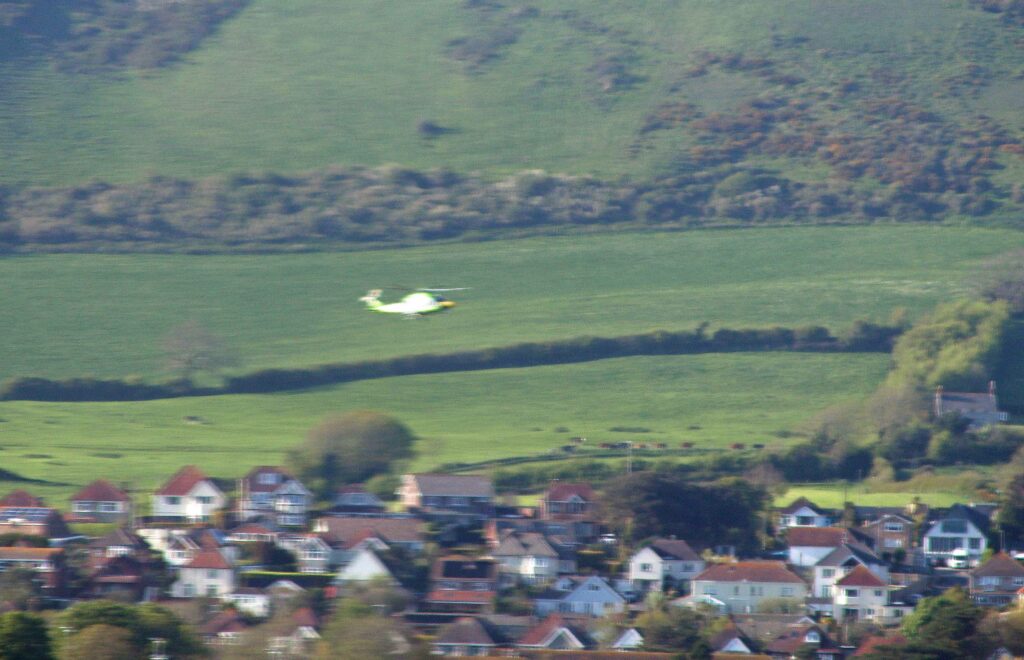 Air ambulance landing in Swanage
