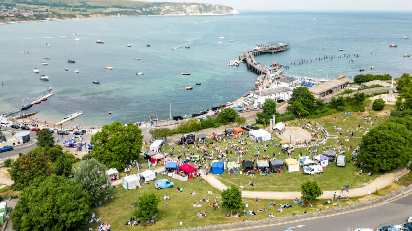 Seen from above, crowds streaming into Prince Albert Gardens for Swanage Fish Festival