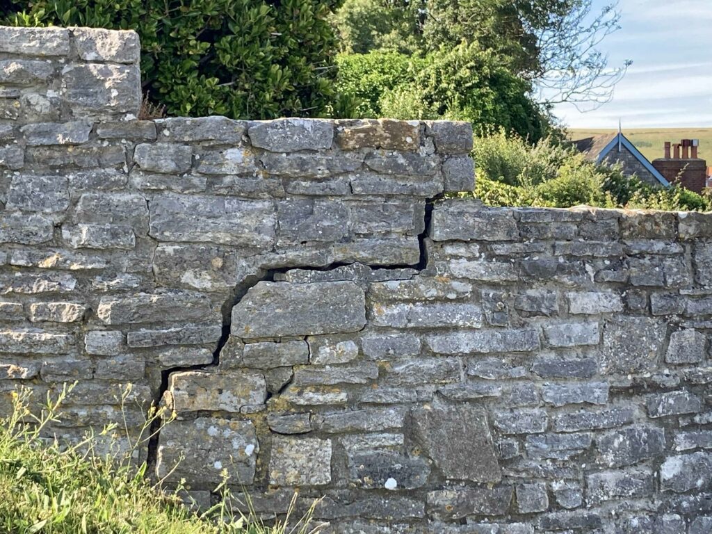 cracks in wall near spa beach huts