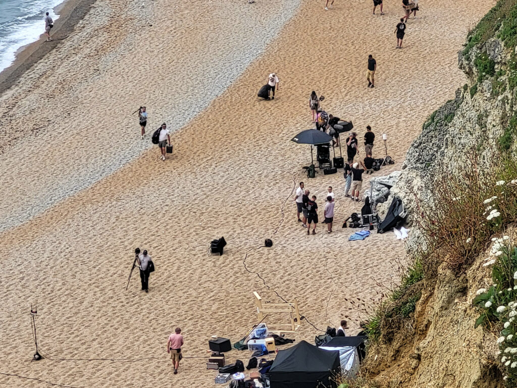 The film crew relaxing between takes on Durdle Door beach