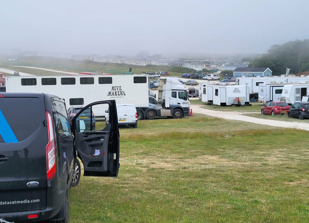 Trailer homes, caterers, lighting crews and many more set up a huge village in Durdle Door car park