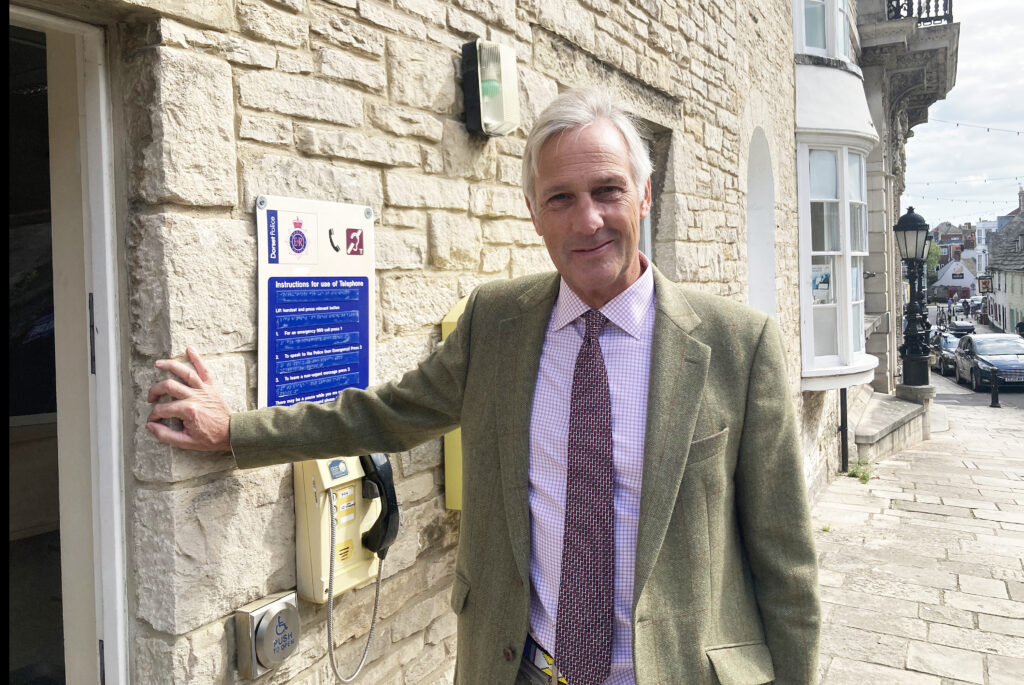 Richard Drax at Police desk reopens photo op in Swanage