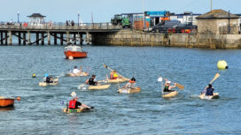 They're off! Eight intrepid captains paddle their self built boats across Swanage Bay