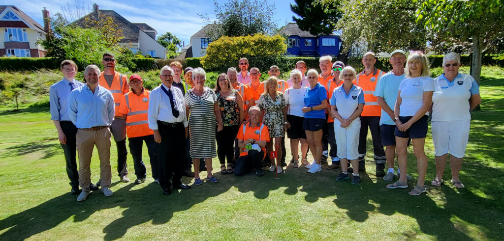 Swanage Town Council officials and employees with sports club members at Beach Gardens