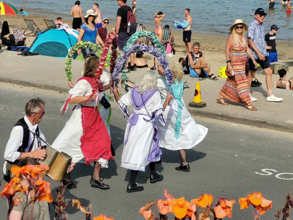 The Magog Ladies danced the length of Shore Road with flower hoops