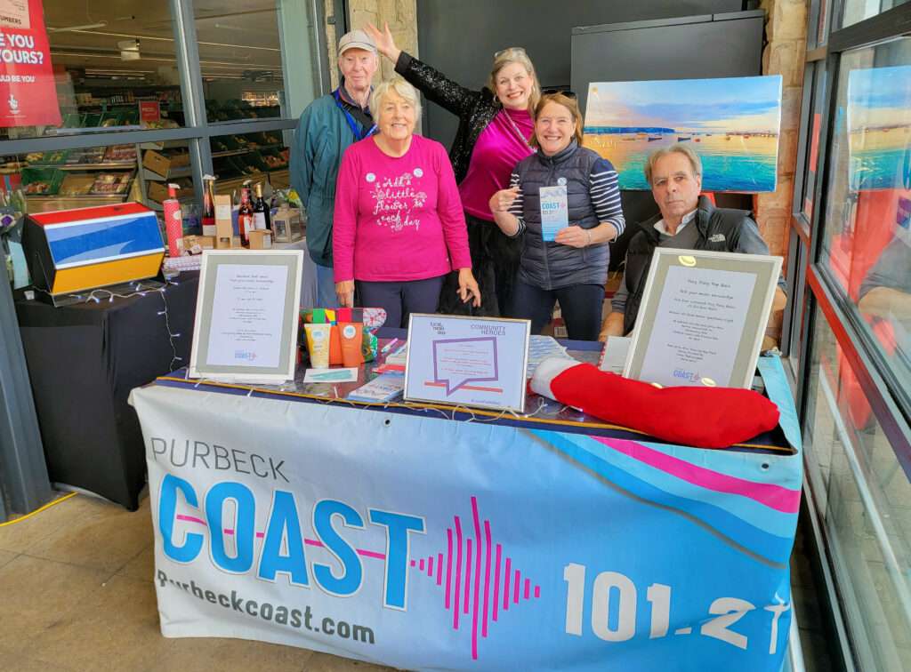 Purbeck Coast presenter Caroline Gray with colleagues on local radio day at Swanage Co-op