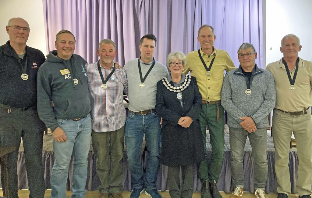 Paul Meacham, Adrian Charters, Mark Blanchard, Dan Bennett, Mayor Tina Foster, James Allen, Martin Steeden and Ian Welsh at Swanage Sea Rowing awards night