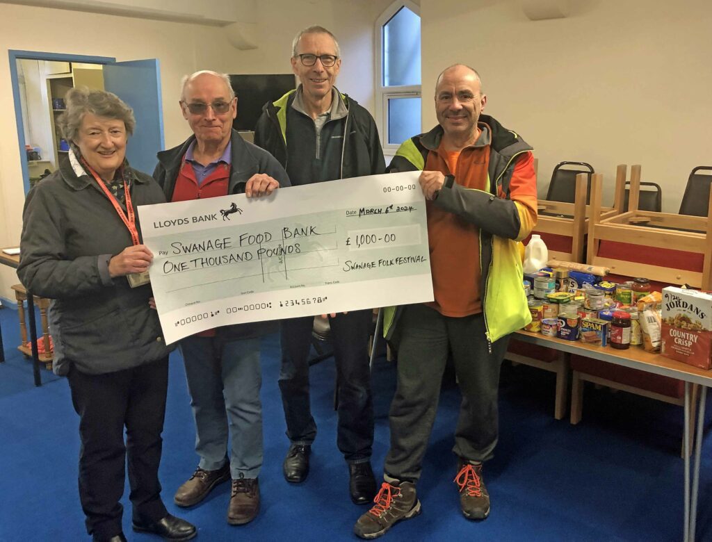 Cheque from Swanage Folk Festival donated to Swanage Food bank